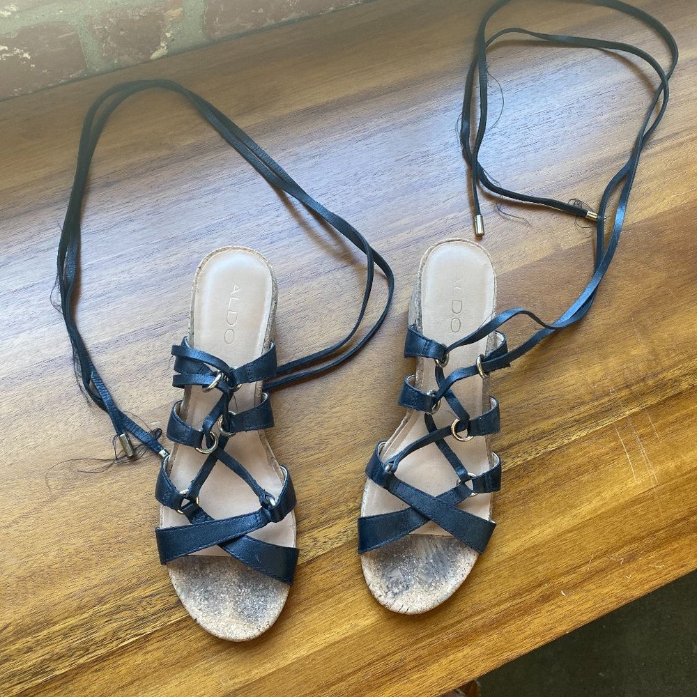 Strappy black sandals with small heel